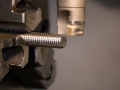 Milling wrench flats on a threaded stud